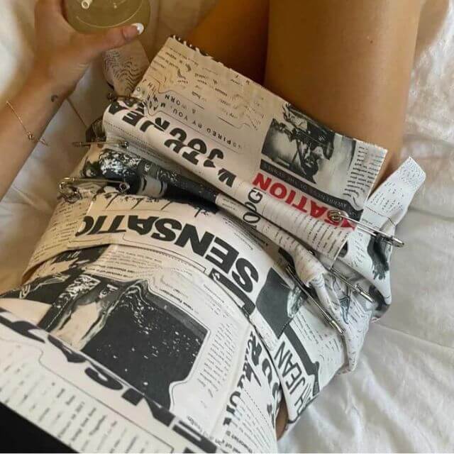 Clarissa - Off-the-shoulder playsuit with newspaper print-DESTINY