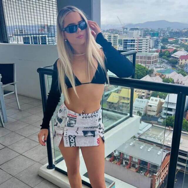 Clarissa - Off-the-shoulder playsuit with newspaper print-DESTINY