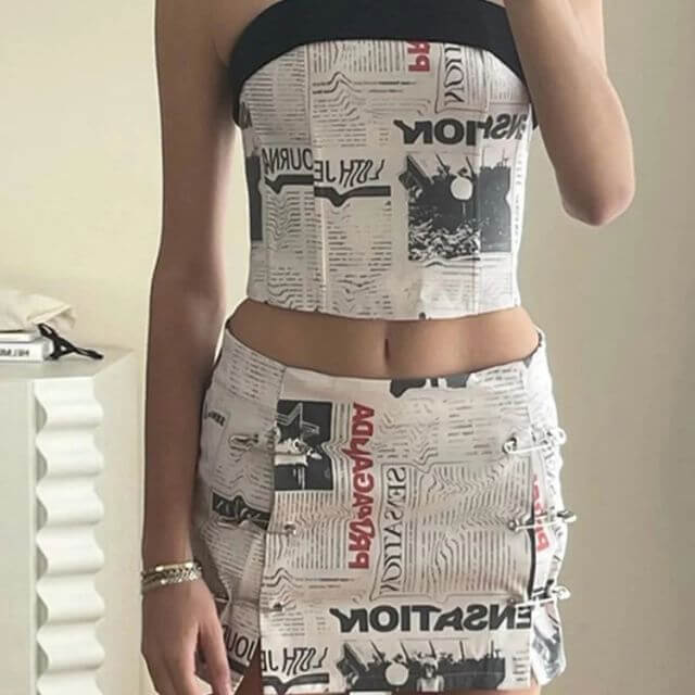 Clarissa - Off-the-shoulder playsuit with newspaper print-DESTINY