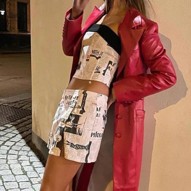 Clarissa - Off-the-shoulder playsuit with newspaper print-DESTINY